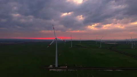 Fly over windmills ecological farm at sunset. Stock Footage 229766543