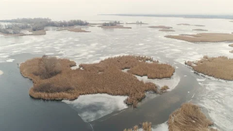 Fly Over Winter Lake Or River With Ice Floes. 4K Aerial. Stock-Footage 101809607