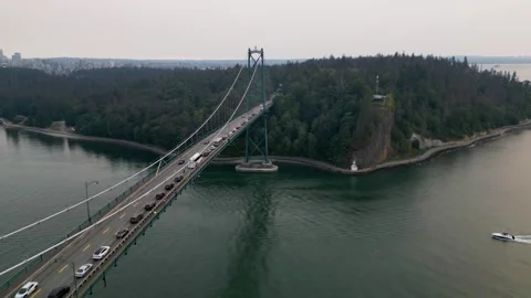 Fly parallel to Lions Gate bridge 動画素材 248476661