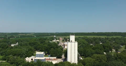 Fly past large silo tower structure over town midwest kansas Video stock 329800396