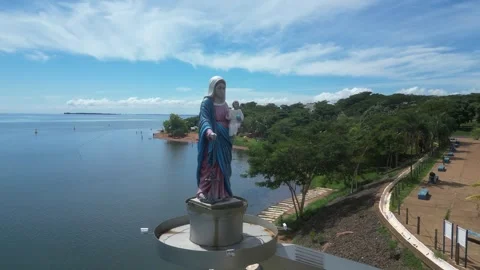 Fly past unique statue of Mary and Jesus on Parana R in southern Brazil Stock-Footage 310322397