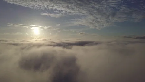 Fly to right, above the clouds during sunrise. Stock Footage 80016082