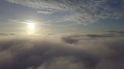 Fly to right, above the clouds during sunrise. Stock Footage 80026319
