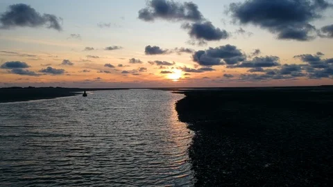 Fly up river towards sunset Stock Footage 122702624