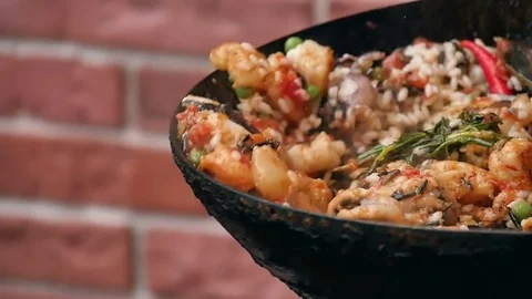 Fly seafood in pan, mixing it 스톡 동영상 74945541