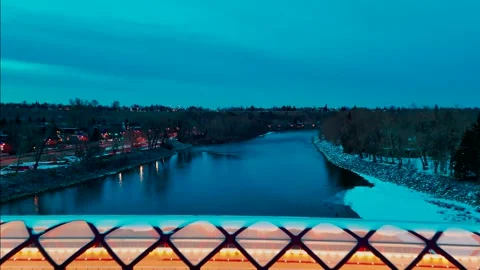 Fly up then push forward above Peace Bridge Calgary Stock Footage 332368031