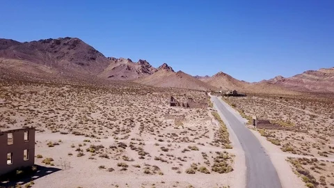 Fly through abandoned bank ghost town Rhyolite nevada Stock Footage 92828451