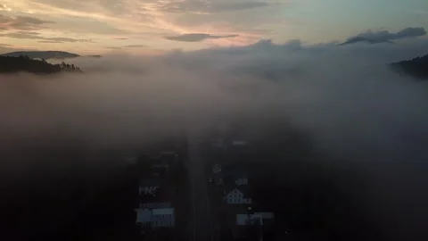 Fly through the Beautiful Low Hanging Clouds Over a Small Town in New Hampshire Stock Footage 275198398