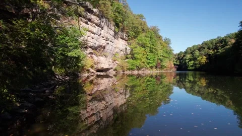 Fly Through Branches Over Beautiful Reflection Lake Daytime Stone Cliff Stock Footage 256172440