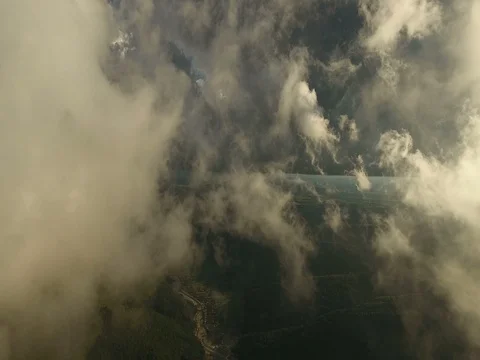 Fly through the clouds. Aerial drone smooth filming above puffy clouds. Stock Footage