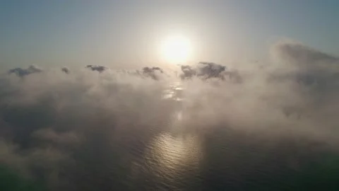 Fly through the clouds during sunrise. An epic shot of clouds in morning colo Stock Footage 160056031