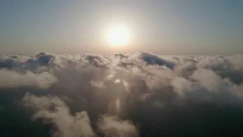 Fly through the clouds during sunrise. An epic shot of clouds in morning colo Stock Footage 164298256