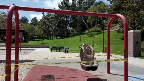 Fly Through Reveal of Close Swing Set at Playground Stock Footage 128273477