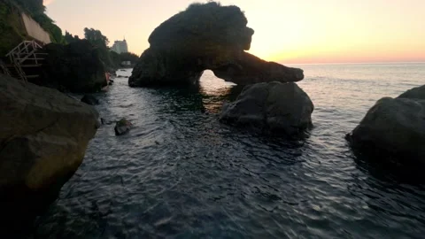 Fly through Rocky Arch, on a sunset. Drone proximity flying. Stock Footage 223924932