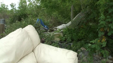 Fly tipping of  old sofas and other household rubbish 08 Stock Footage 49952362