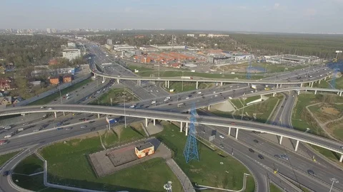 Fly up from the top to the junction with a view of the city buildings Stock Footage 86372524