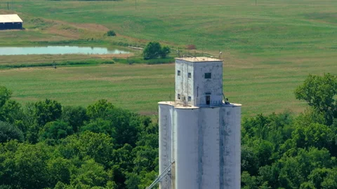 Fly toward large silo tower structure midwest kansas Stock Footage 329780806