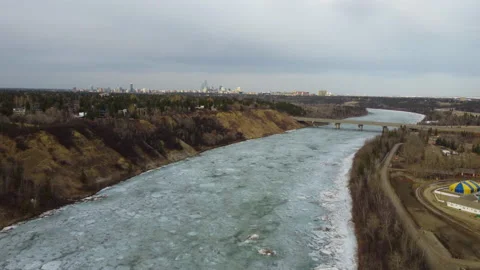 Fly Towards Quesnell Bridge with Downtown Edmonton in Distance Stock Footage 151881497