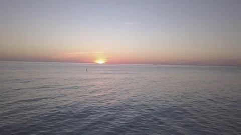 Fly towards sunset low over the water Stock Footage 82759056