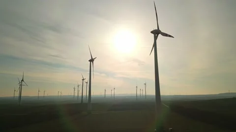 Fly trough a field of wind turbines Video stock 232959982