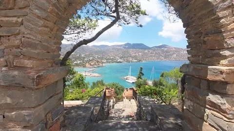 FLY UNDER ARCH AND OVER A BEAUTIFUL BAY Stock Footage 280917747