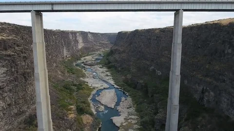 Fly under bridge canyon Stock Footage 69178446