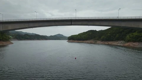 Fly under bridge over a Lake in Japan Video stock 156614215