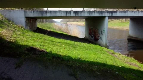 Fly under bridge tags grass Stock Footage 150975387