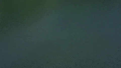 Fly under the mountain lake Stock Footage 77686687