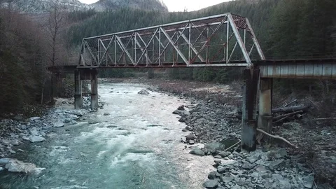 Fly under Train bridge over a River Stock Footage 105258735