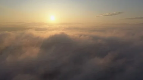 Fly into white clouds in blue sky at morning. 库存影片 120551824