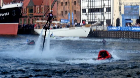 Flyboard acrobatics show, back and frontflip, front flip master Stock Footage 93688587