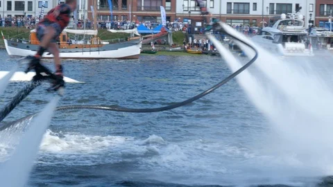 Flyboard acrobatics show, backflips synchro Stock-Footage 93688148