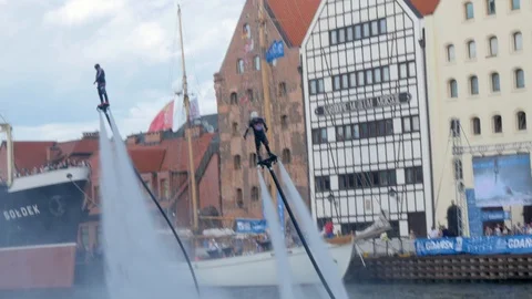 Flyboard acrobatics show, crazy backflip, falling to water, dolphin Stock Footage 93688771