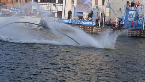 Flyboard acrobatics show, crazy backflip, dolphin trick Stock Footage 93698292