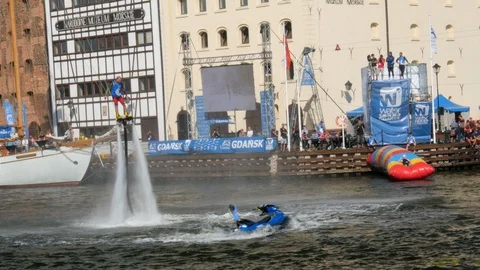 Flyboard acrobatics show, series of backflips Stock Footage 93687573