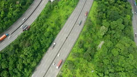 Flyby drone over three parallel roads passing through the Jungles of the Stock Footage 139707531