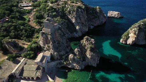 Flyby over the ancient medieval tower over the Stacks of Scopello (Sicily) Stock Footage 121207948