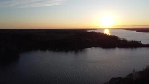 Flyby over Sunset River wrapped around the Forest Drone 4K Video stock 306309556