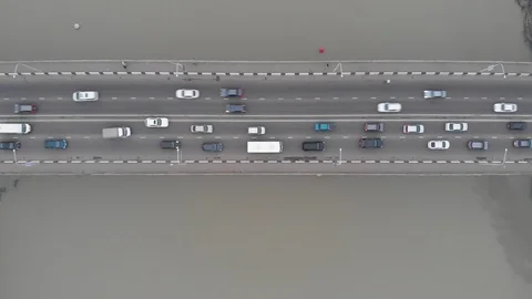 Flycam films long grey multi-lane bridge with traffic jam Stock Footage 116985343