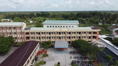 Flycam at Giong Rieng High School in Giong Rieng District, Kien Giang Province,  Stock Footage 130517543