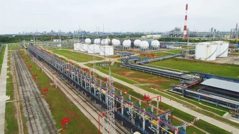 Flycam Moves over Refinery Complex with Reservoirs and Pipelines Stock Footage 81801468