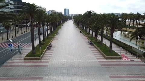 Flycam rises above empty pedestrian zone on seafront Stock Footage 103298984