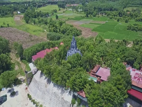 Flycam Rotates above Temple Complex against Landscape Stock Footage