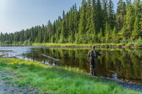 Flyfisherman casting in the river Stock-Fotos
