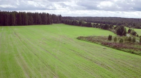 Flying Above Agricultural Fields in Cloudy Weather Stock Footage