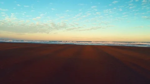 Flying above the beach and waves at dusk , close up zoom in motion , aerial Stock Footage 83613103