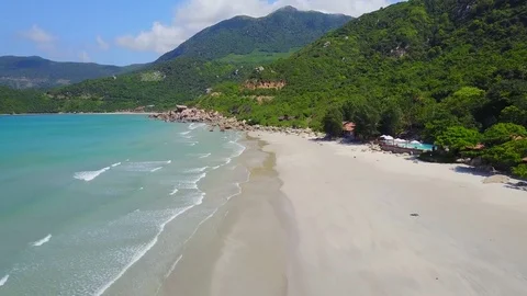 Flying above the beach, over a a reef and blue ocean Aerial view of beautiful 動画素材 74434020