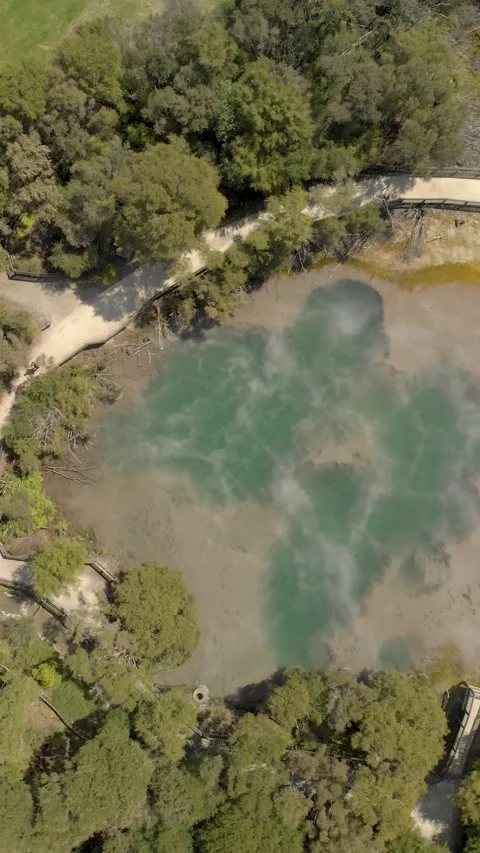 Flying above big hot spring in Kuirau Park in the city of Rotorua, New Zeal.. Stock Footage 290126176