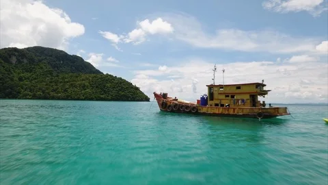 Flying above the boat in the ocean Stock Footage 89949692